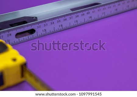 Hand tools yellow ruller, stapler, tape measure
