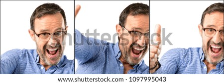 Middle age handsome man closeup stand happy and positive with thumbs up approving with a big smile expressing okay gesture