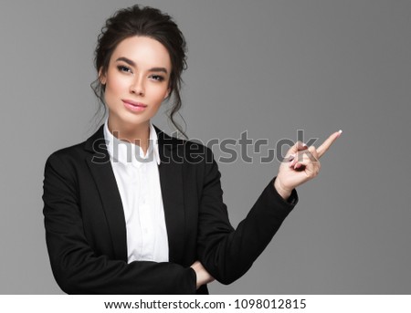 Asian business woman over gray background portrait