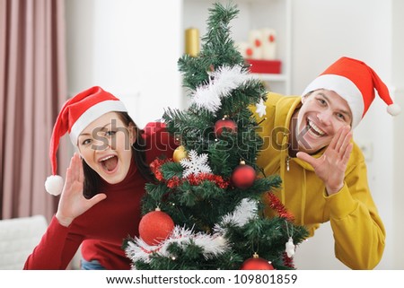 Young couple having fun Christmas time