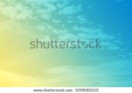 soft sun and cloud background with a pastel colored gradient.