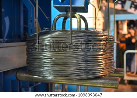steel wire drawing machine at the metallurgical plant Royalty-Free Stock Photo #1098093047