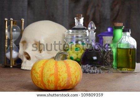 Halloween still life with pumpkin and potions