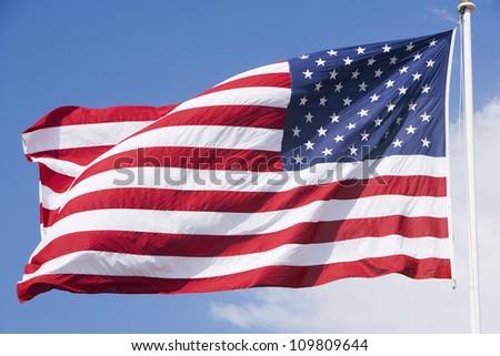 American flag with sky in the background