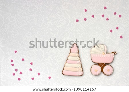 Celebrate birthday of  little baby. Cookies in shape of accesssories for child on colorful  background, top view