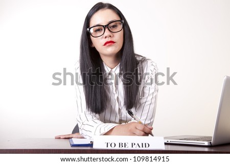 Portrait of a young attractive female receptionist with a sign to be paid.