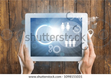 Hand touching tablet with cloud computing icon