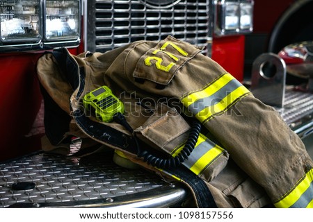    Firefighter coat on the fire truck                             Royalty-Free Stock Photo #1098157556