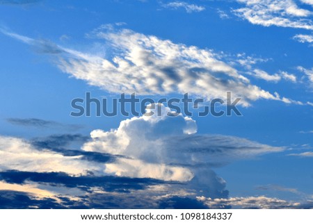 strange white cloud pattern in blue sky