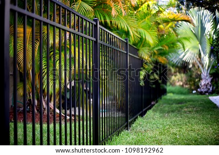 Black Aluminum Fence  Royalty-Free Stock Photo #1098192962