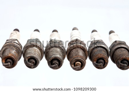 Heavily worn spark plugs isolated on white
