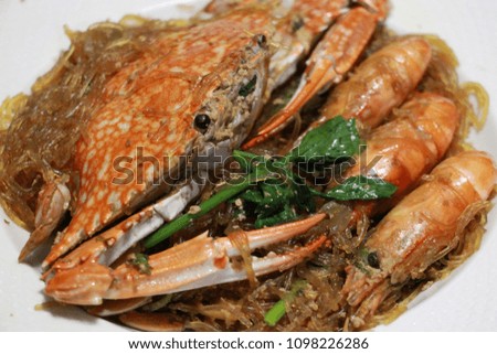 Shrimps roasted and crab with vermicelli in white plate, Thai food, Thailand