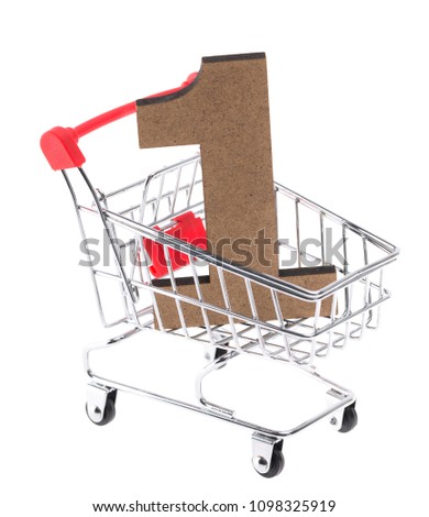 the wooden three-dimensional volumetric digit "1" in a mini shopping trolley cart on white background