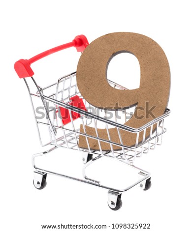 the wooden three-dimensional volumetric digit "9" in a mini shopping trolley cart on white background