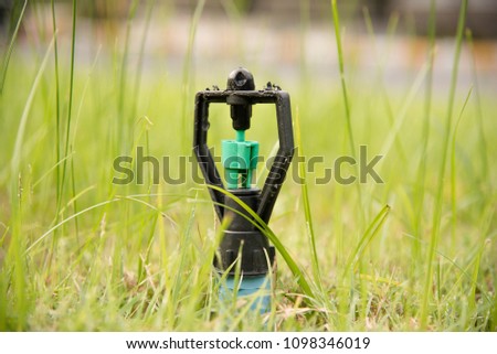 springer for watering in the lawnm, to moisturize the trees and flowers