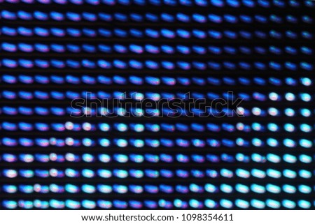 LED lights on the billboard. This is blurred photography, taken by slow shutter speeds and moving the camera in different directions while pressing the shutter button. This is not the illustration. 