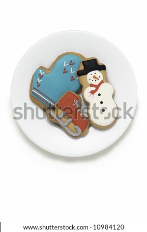 Decorated Christmas holiday cookies on white plate