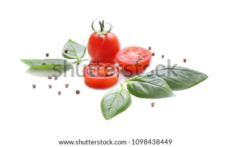 Fresh basil leaves, spices and tomatoes on white background