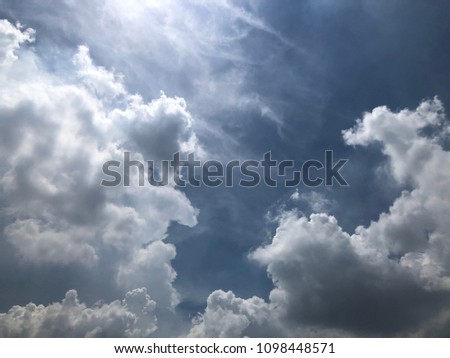 Bright sky with white clouds.