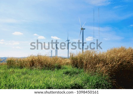 Wind turbines generating electric power with blue sky