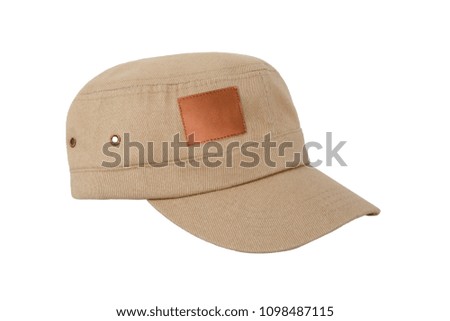 Fashionable beige jeans golf cap with leather blank tag isolated on white background