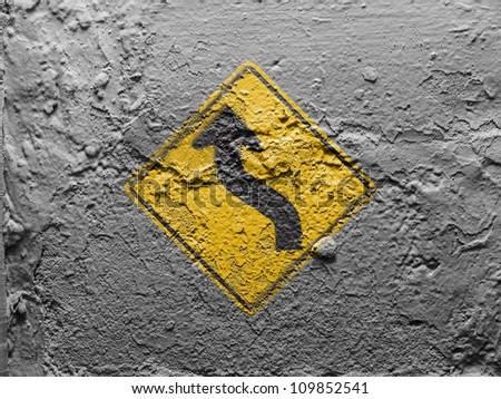 Turn road sign painted on grunge wall