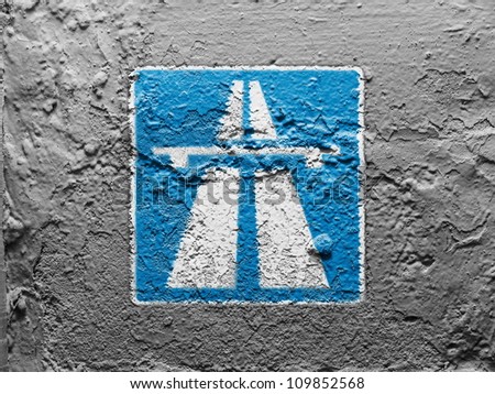 Autobahn road sign painted on grunge wall