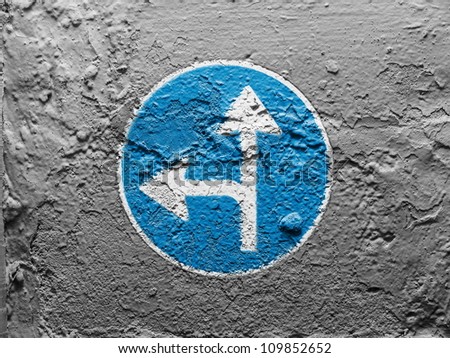 road sign painted on grunge wall