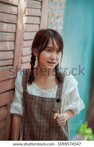 Outdoors portrait of beautiful young girl,