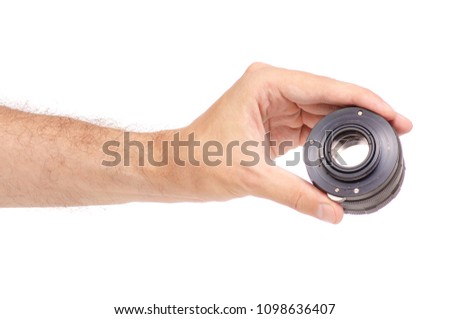 Lens objective in hand on white background isolation