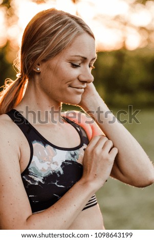 
Young attractive woman is doing yoga exercises in nature