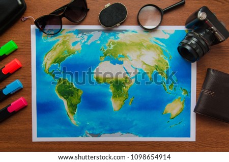 World map on a wooden table top view. Concept travel adventure vacation
