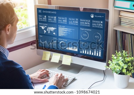 Digital marketing campaign data analytics report with metrics and key performance indicators (KPI) on information dashboard for advertisement strategy on internet, business person in office Royalty-Free Stock Photo #1098674021