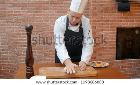 Chef kneading a dough