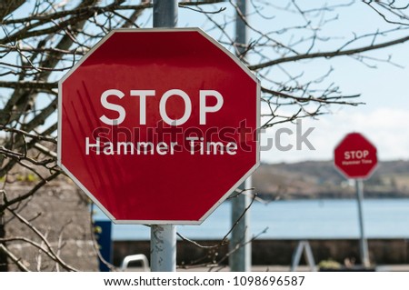 Sign at a stop junction in Ireland saying "Stop Hammer Time" Royalty-Free Stock Photo #1098696587