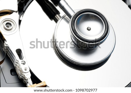 Data security concept. Hard disk diagnose with stethoscope.