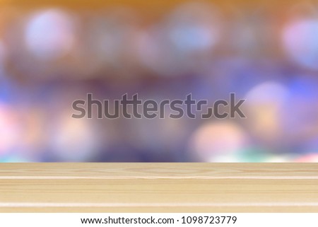 Wooden floor and blurred colorful light bokeh space background montage style, For place the product.