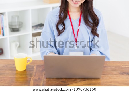 asian woman using laptop, hands