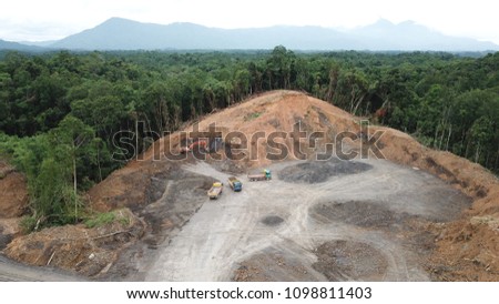Deforestation aerial photo. Rainforest jungle in Borneo, Malaysia, destroyed to make way for oil palm plantations 