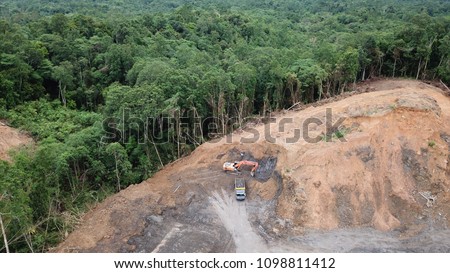 Deforestation aerial photo. Rainforest jungle in Borneo, Malaysia, destroyed to make way for oil palm plantations 