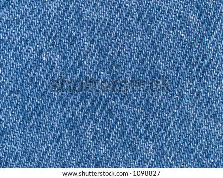 Stock macro photo of the texture of blue denim fabric.  Useful for layer masks and abstract backgrounds.