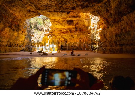 Idyllic site to take a picture, beautiful cave on the Atlantic coast in Algarve, Portugal