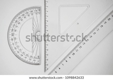 Set of multiple plastic rulers and the protractor, isolated over the white background