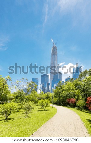 road of a modern city with skyscrapers as background