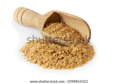 Nutritional brewers yeast flakes in wooden scoop isolated on white background Royalty-Free Stock Photo #1098854321