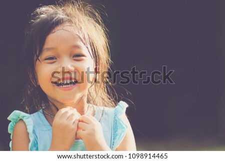 Asian smiling little girl portrait.