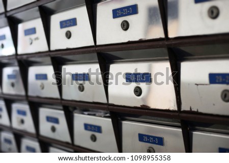 silver metallic mailbox array tidy under residential apartment