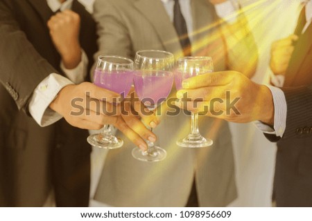 Business group cheers, wine glasses,Celebrating success