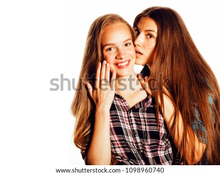 two cute teenagers having fun together isolated on white