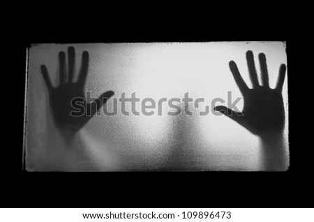 Spooky man behind glass. Hands and blurry human figure abstraction. Royalty-Free Stock Photo #109896473
